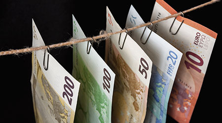 What is money laundering according to UAE Law?